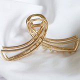 Haarklem Double Swirl Goudkleurig