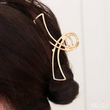 Haarklem Double Swirl Goudkleurig